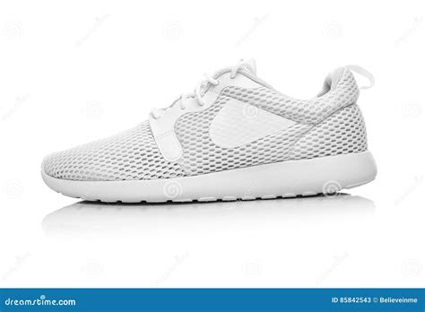 unbranded white sneakers.